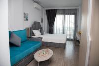 A bed or beds in a room at Amalia Rooms Sea View