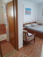 Postel nebo postele na pokoji v ubytování Apartments Erceg
