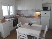 Kuchyňa alebo kuchynka v ubytovaní Apartman s pogledom