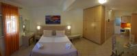 Postel nebo postele na pokoji v ubytování Angelica Hotel