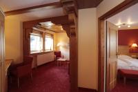 Ein Bett oder Betten in einem Zimmer der Unterkunft AKZENT Hotel Berg's Alte Bauernschänke- Wellness und Wein