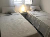 Postel nebo postele na pokoji v ubytování Appartement avec Solarium