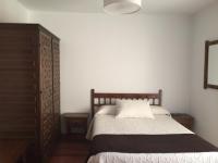 A bed or beds in a room at Hotel Rural Nova Ruta