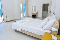 Posteľ alebo postele v izbe v ubytovaní Verga Villas Resort