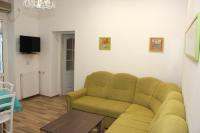 Televízia a/alebo spoločenská miestnosť v ubytovaní Apartmani Palmas Rijeka