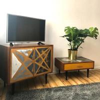 Televízia a/alebo spoločenská miestnosť v ubytovaní Apartament Viktoria