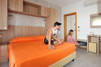 Posteľ alebo postele v izbe v ubytovaní Hotel Lidia