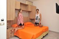 Posteľ alebo postele v izbe v ubytovaní Hotel Lidia