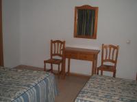Postel nebo postele na pokoji v ubytování Hostal Centro