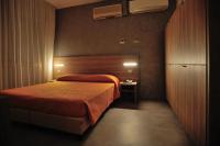 Posteľ alebo postele v izbe v ubytovaní Hotel Lidia