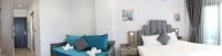 A bed or beds in a room at Amalia Rooms Sea View
