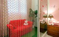 a childs room with a red chair with teddy bears at sweet home B&amp;B in Hualien City