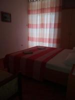 Postel nebo postele na pokoji v ubytování Apartments Erceg