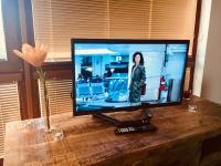 A television and/or entertainment centre at Grand Spa Holiday Home