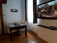 Televízia a/alebo spoločenská miestnosť v ubytovaní Sunny city center