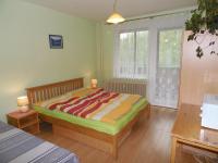 A bed or beds in a room at Apartmán Zdravie Horný Smokovec