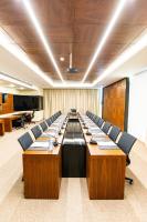 a large conference room with a long table and chairs at Maximus Hotel Byblos in Jbeil