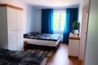 Łóżko lub łóżka w pokoju w obiekcie Apartament Mieszczański