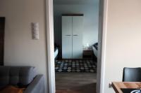 Łóżko lub łóżka w pokoju w obiekcie Apartament Mieszczański