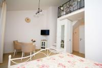 Televízia a/alebo spoločenská miestnosť v ubytovaní Apartments Tomaš
