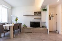 Televízia a/alebo spoločenská miestnosť v ubytovaní Milano Business Balcony Flat