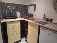 Kuchyň nebo kuchyňský kout v ubytování Apartmány Karlštejn