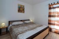 Posteľ alebo postele v izbe v ubytovaní Apartments Intrada