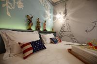 a bed with an american flag pillow and figurines on it at Sweet Heart B&amp;B in Ji&#39;an