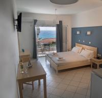 Posteľ alebo postele v izbe v ubytovaní Filanthi Apartments