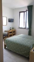 A bed or beds in a room at Hotel San Remo