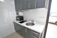 A kitchen or kitchenette at APARTMENT TIMPLE Puerto del Carmen
