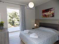 Posteľ alebo postele v izbe v ubytovaní Eirini & Manolis Apartments