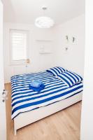 Posteľ alebo postele v izbe v ubytovaní Apartament Blue Point 102 PREMIUM