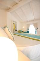 A bed or beds in a room at Il Borghetto Resort & Spa