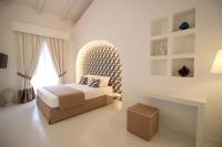 A bed or beds in a room at Il Borghetto Resort & Spa