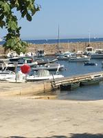 a group of boats docked in a harbor at Le Goeland 3 ,balcon petite vue mer latérale au 3 eme étage sans ascenseur in Toulon