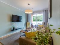 Televízia a/alebo spoločenská miestnosť v ubytovaní Lux Apartment Kołobrzeg Polanki Park