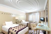 Postel nebo postele na pokoji v ubytování Taxim Hill Hotel
