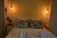 Postel nebo postele na pokoji v ubytování Candia Suites & Rooms