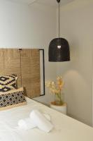 Postel nebo postele na pokoji v ubytování Candia Suites & Rooms