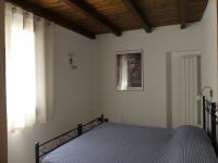 A bed or beds in a room at Agriturismo La Vigna