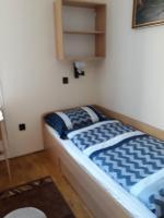 Łóżko lub łóżka w pokoju w obiekcie Ádám Vendégház