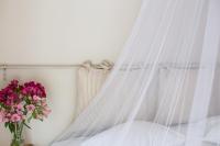 Postel nebo postele na pokoji v ubytování Kuursaal Guesthouse