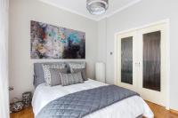 A bed or beds in a room at Acropolis Stylish Suite