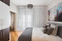 A bed or beds in a room at Acropolis Stylish Suite