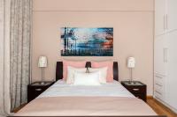 A bed or beds in a room at Acropolis Stylish Suite