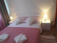 Posteľ alebo postele v izbe v ubytovaní Apartman Lapis