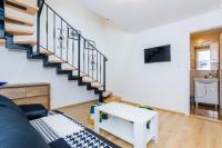 TV a/nebo společenská místnost v ubytování Rooms Baza