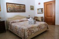 Posteľ alebo postele v izbe v ubytovaní B&B Maria Piddu