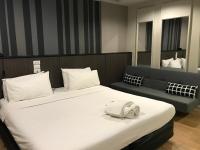 Postel nebo postele na pokoji v ubytování Paragon Inn